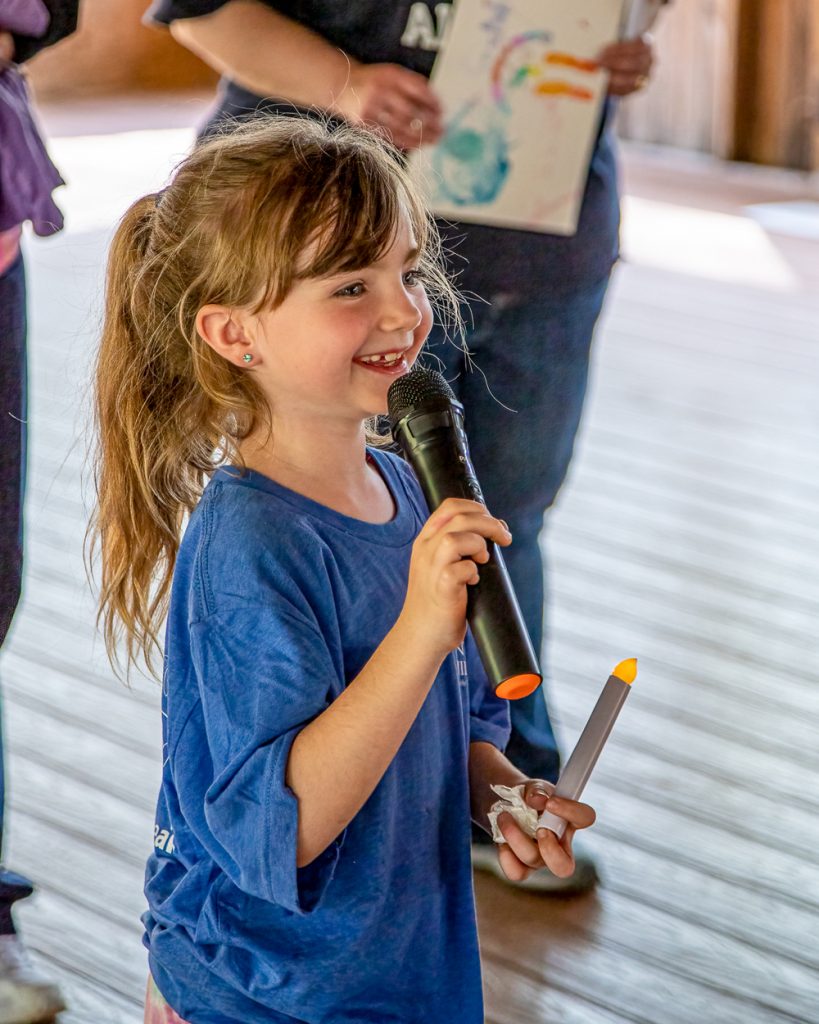Small Girl Holding Microphone