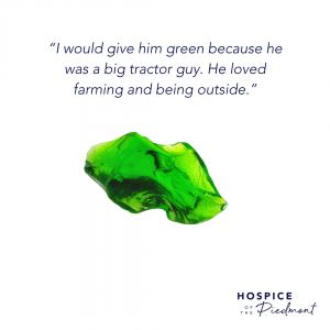 A piece of green sea glass with the quote, “I would give him green because he was a big tractor guy. He loved farming and being outside.”